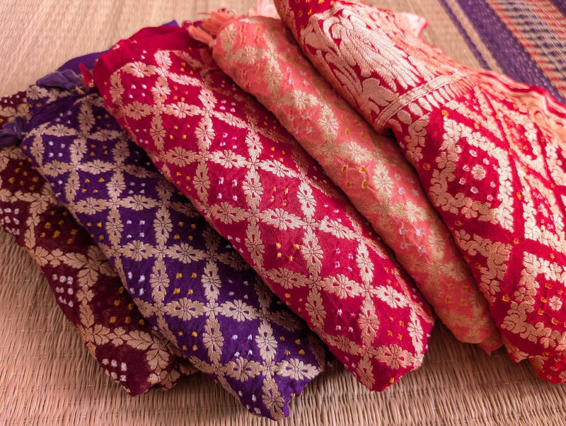 a stack of beautiful bandhani dupattas in pure georgette