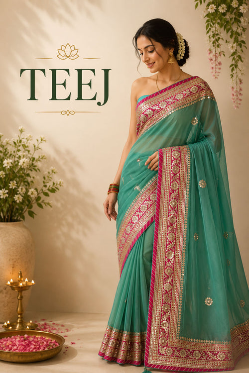 Woman wearing a pink Bandhani silk saree with traditional jewelry during Teej celebrations.
