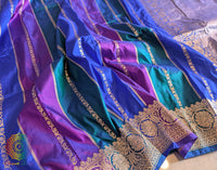 Close up of Katan silk texture on blue Banarasi saree