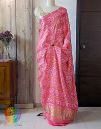 Close up of Bandhani work on Coral Pink Gajji silk Gharchola saree