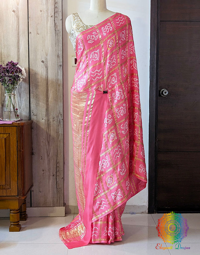 Coral Pink Gharchola Bandhani saree with traditional Gujarati tie dye