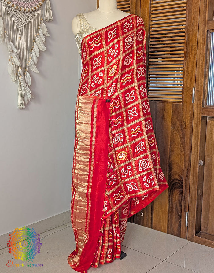 Orange Gharchola Bandhani saree with traditional Gujarati tie dye