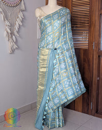 Powder Blue Gharchola Bandhani saree with traditional Gujarati tie dye