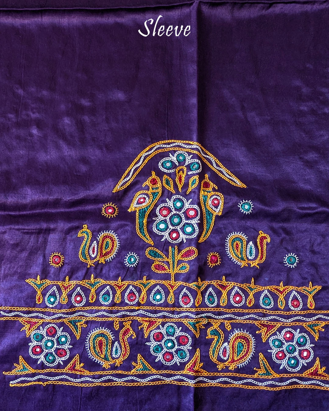 Close-up of Kutch embroidery on sleeve of Purple Mashru Silk Blouse Piece