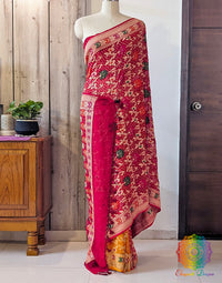 Close up of Bandhani work on red yellow Banarasi georgette saree