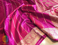 Close up of Katan silk texture on Red Pink Banarasi saree