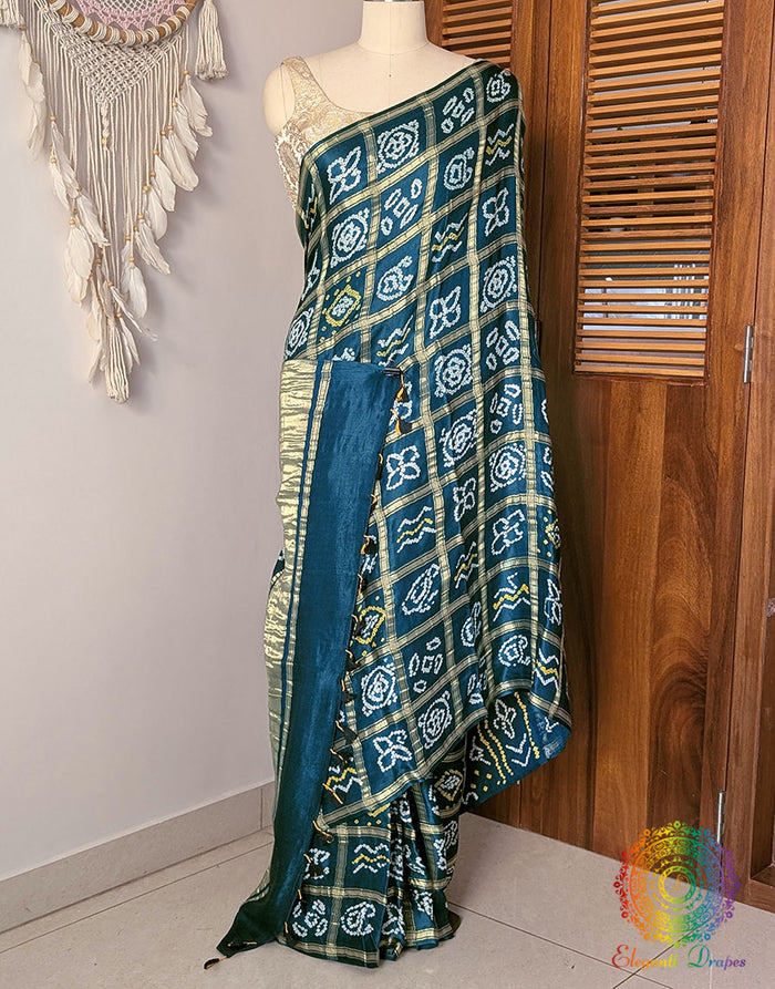 Turquoise Gharchola Bandhani saree with traditional Gujarati tie dye