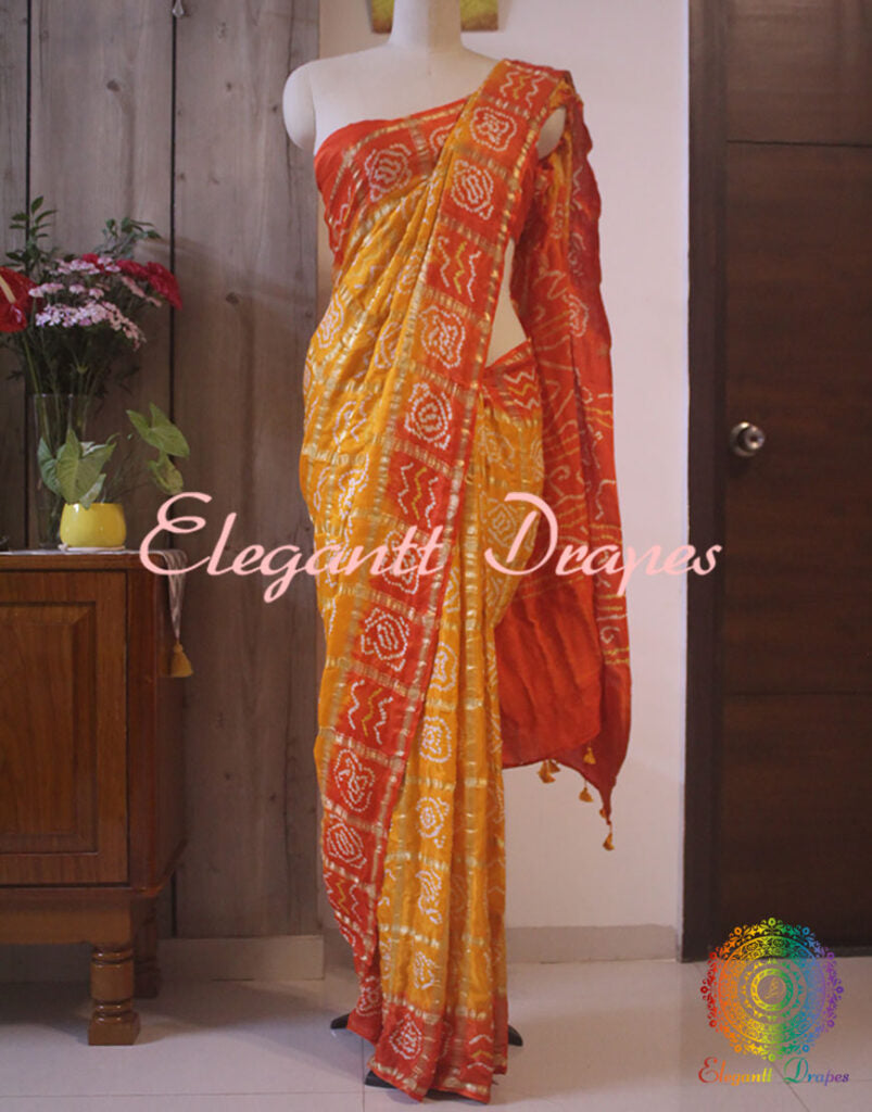 Close up of Bandhani work on Yellow Orange Gajji silk Gharchola saree