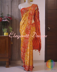 Close up of Bandhani work on Yellow Orange Gajji silk Gharchola saree