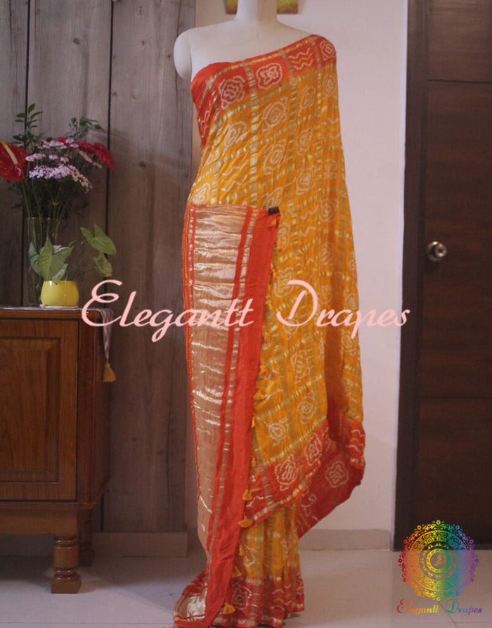 Yellow Orange Gharchola Bandhani saree with traditional Gujarati tie dye