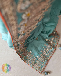 Close-up of Gota Patti and Sequin Handwork motifs on Aqua Blue Satin Crepe Saree