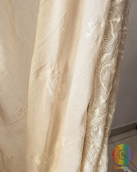 Close up of delicate thread embroidery on beige Bengal cotton saree