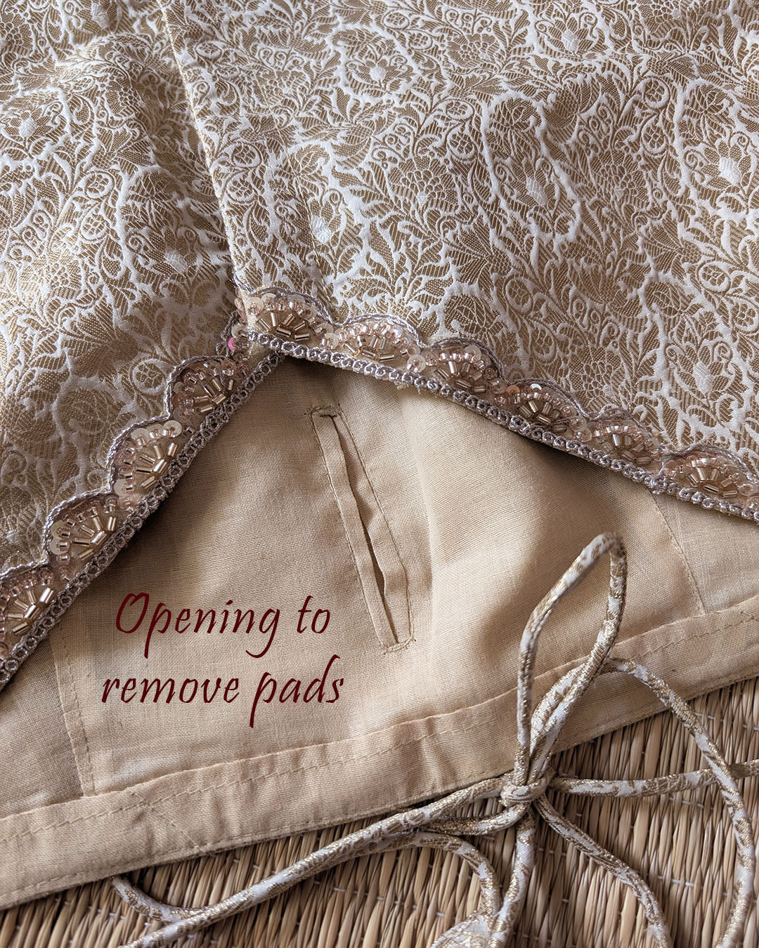 Back opening of the Champagne Beige Banarasi Brocade Designer Blouse showing removable pad access