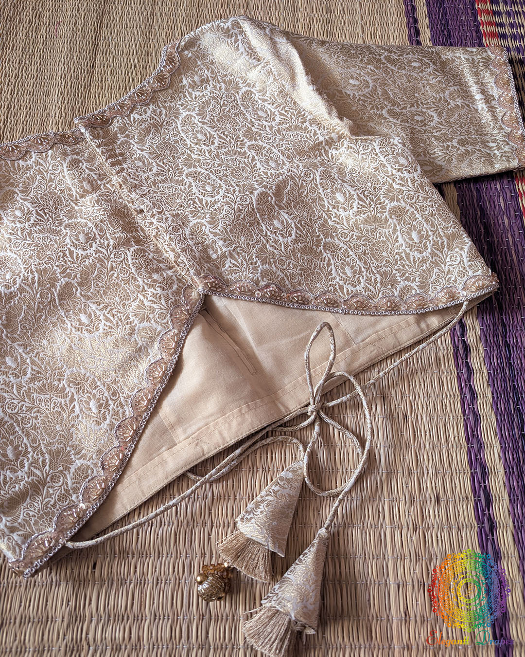 Back view of the Champagne Beige Banarasi Brocade Designer Blouse with back hook closure and tassels