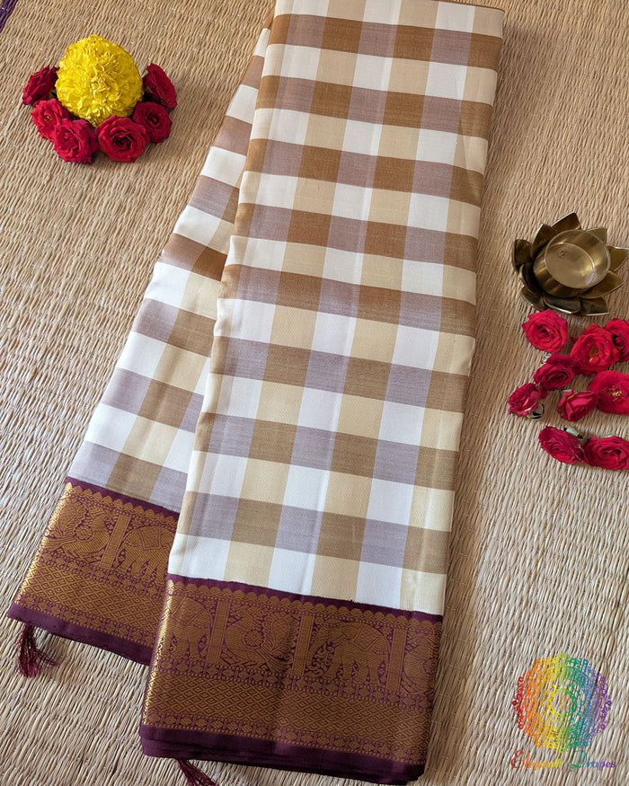 Off White Beige Checkered Pure Kanjivaram Handloom Silk Saree – Folded View showcasing the elegant combination of off white and beige checks, lustrous pure silk fabric and traditional 1gm gold zari detailing.