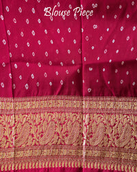 Matching blouse piece in beige red Banarasi khaddi georgette fabric showing weave detail