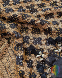 Close-up of traditional kodi tassels, zari border, and Bandhani motifs on black Banarasi georgette Gharchola dupatta
