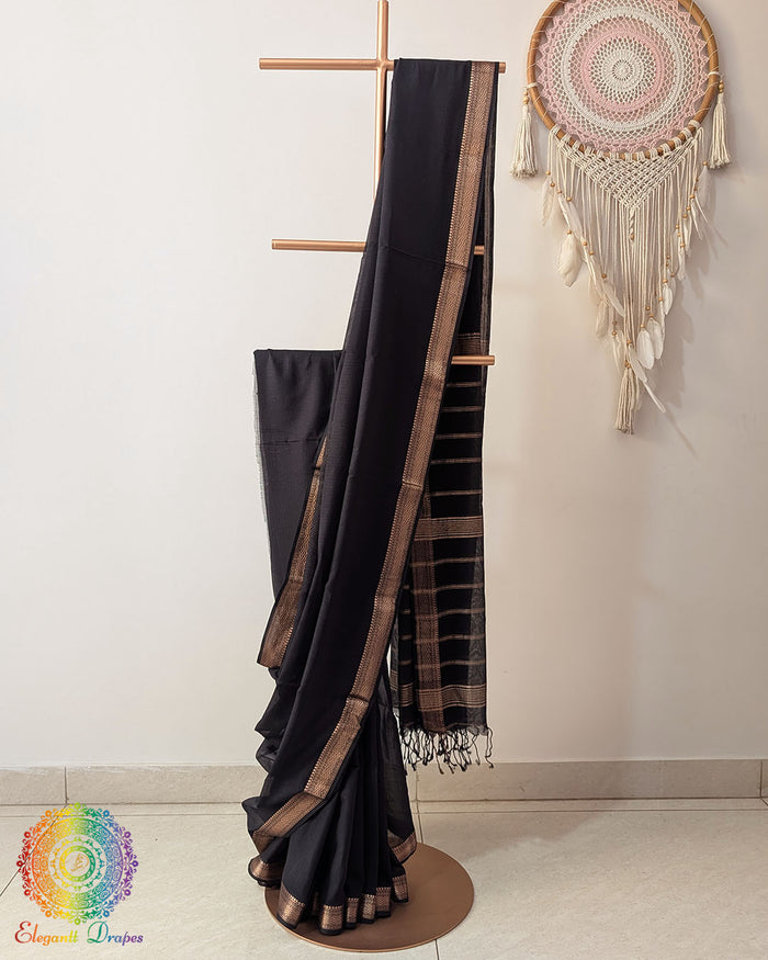 Black Bengal cotton saree with zari border on mannequin showing full drape