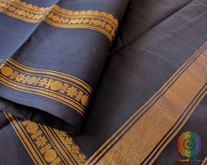 Close up of border on black Kanchi cotton saree highlighting weave detail
