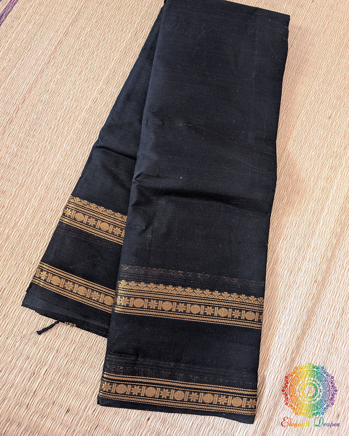 Black Kanchi cotton saree folded view showing deep tone and fabric texture