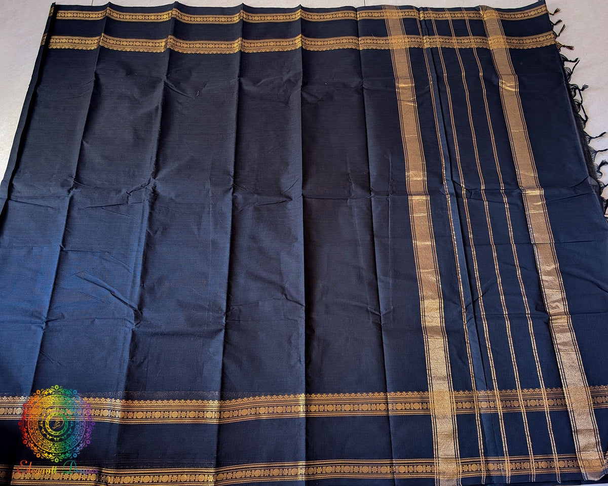 Full black Kanchi cotton saree laid flat showing overall design and drape