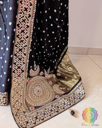 Close up of black bandhani gaji silk saree highlighting marodi and gota patti handwork