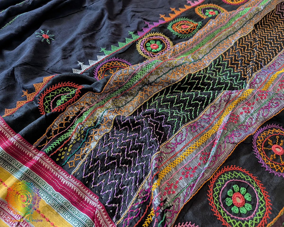 Close-up of intricate multicolored Lambani hand embroidery on the richly embellished palla