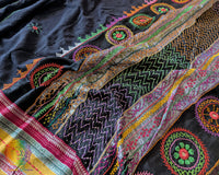 Close-up of intricate multicolored Lambani hand embroidery on the richly embellished palla