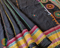Black Ilkal cotton saree highlighting decorative Lambani embroidered bels