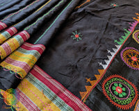 Side view of black Ilkal cotton saree featuring handcrafted Lambani embroidery