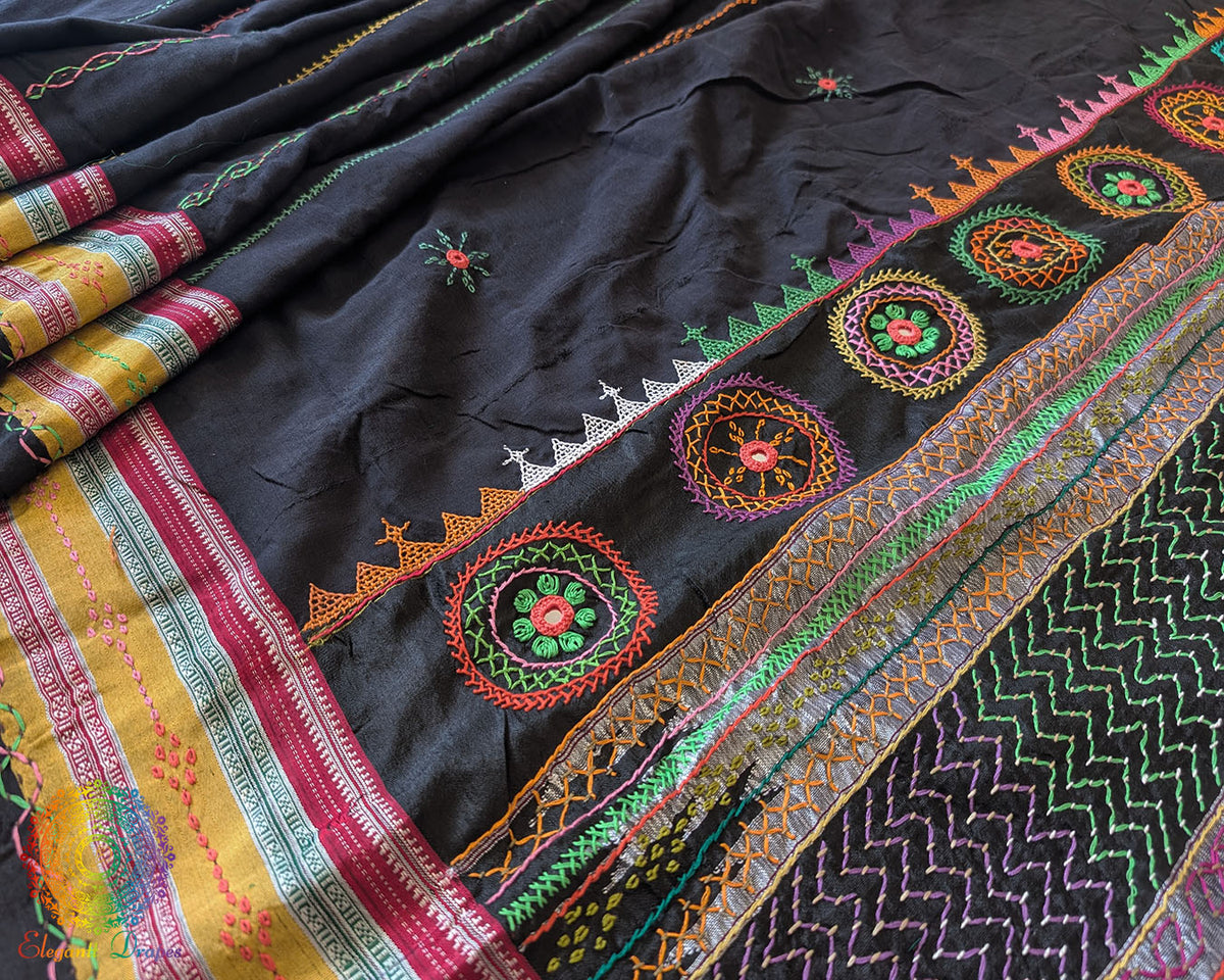 Black Ilkal cotton saree showcasing approximately half-meter heavy Lambani hand embroidered palla