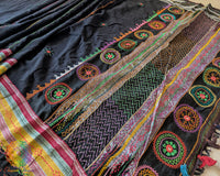 Detailed view of handcrafted Lambani embroidery on the black Ilkal cotton saree