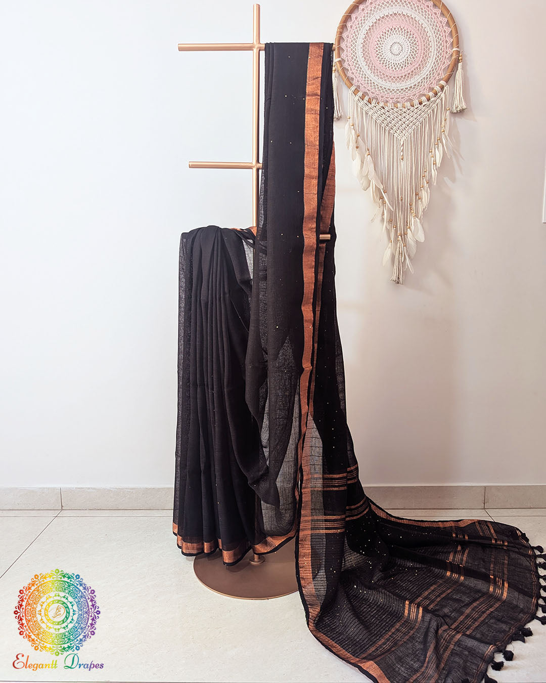 Black linen saree with sequins on mannequin showing complete drape