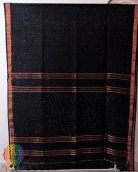 Full black linen saree laid open showing overall design and layout