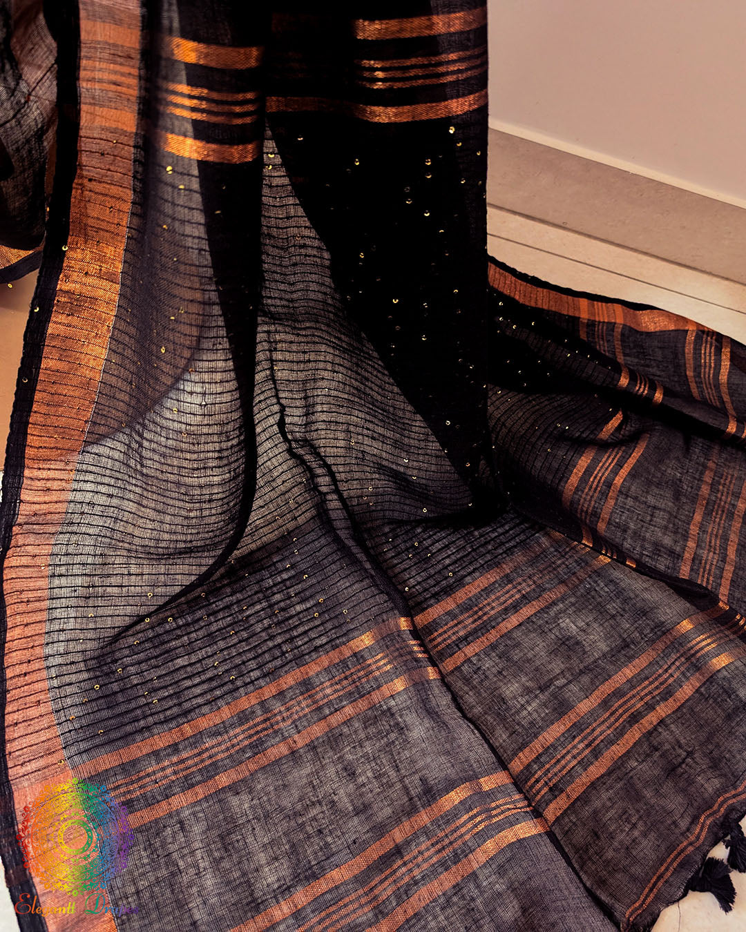Sequin detail close up on black linen saree highlighting subtle shimmer