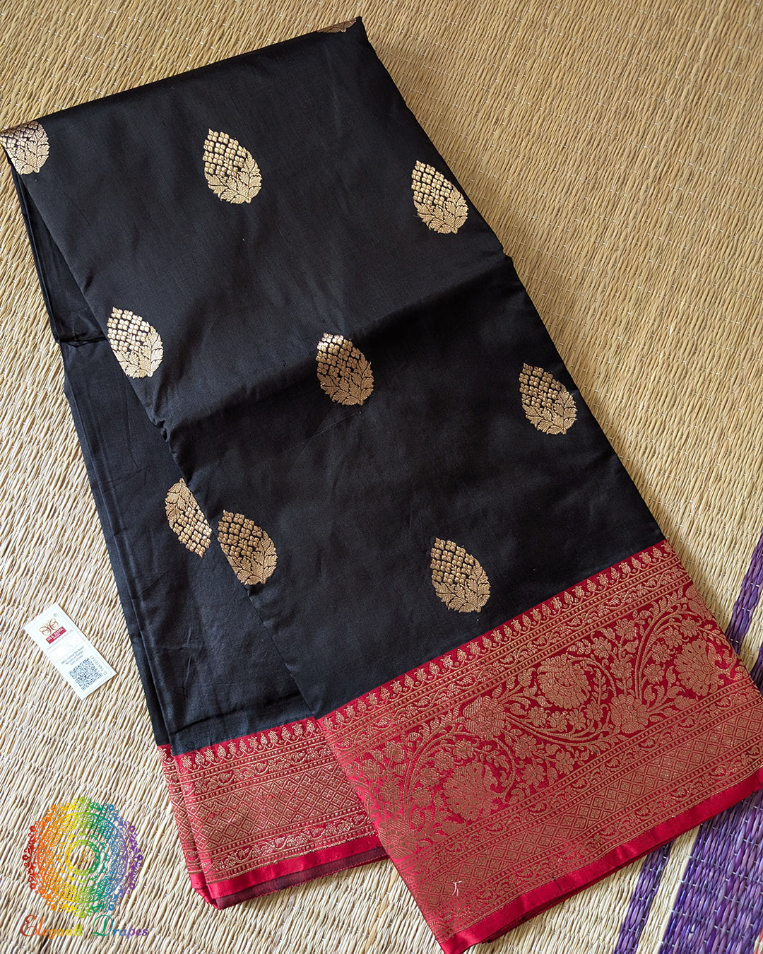 Folded black red Banarasi handloom Katan silk saree showing woven texture and border