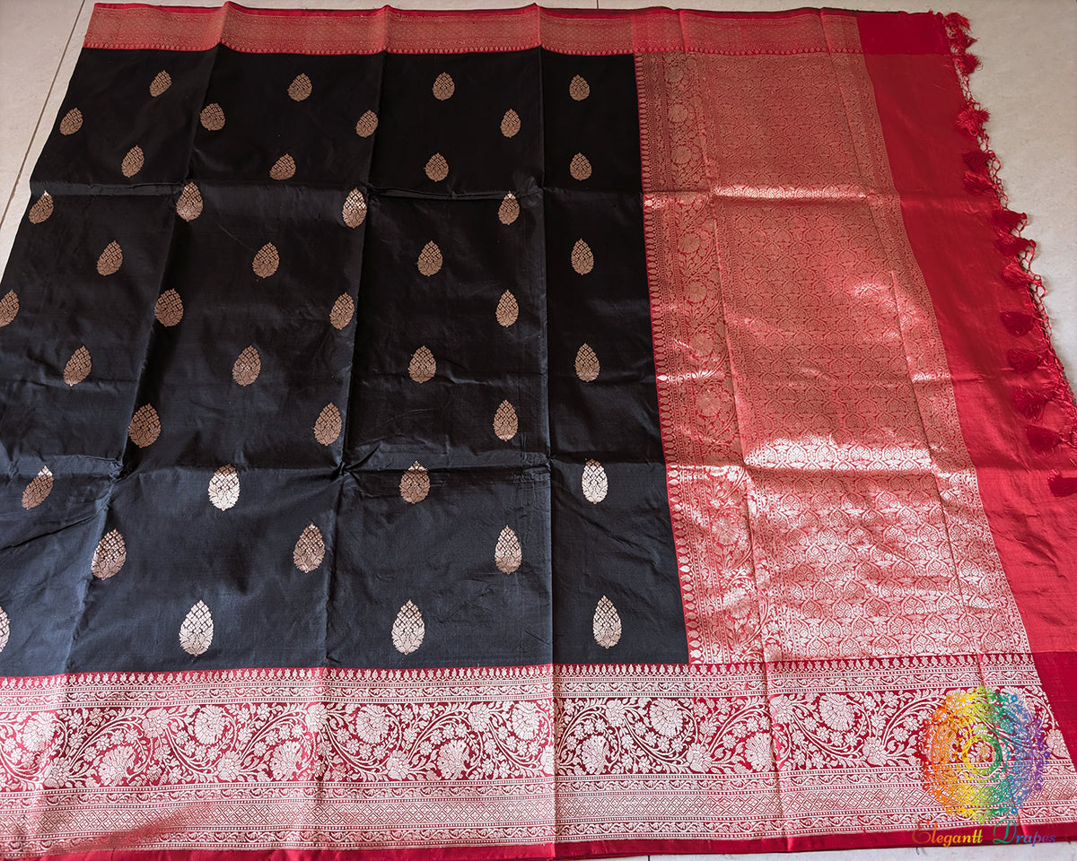 Full black red Banarasi Katan silk saree laid open showing overall design and drape