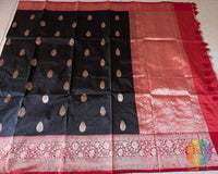Full black red Banarasi Katan silk saree laid open showing overall design and drape