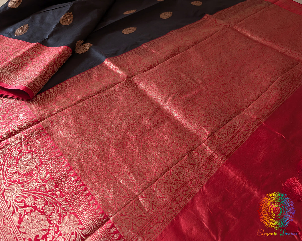 Red palla close up on black Banarasi handloom Katan silk saree showcasing weave