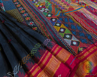 Lambani embroidery detail on black and red Ilkal silk saree