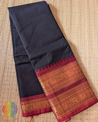 Folded black red pure Kanchi cotton saree showing red border detail