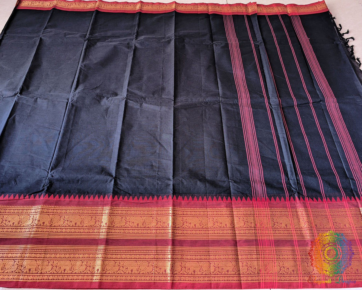 Full black red Kanchi cotton saree laid open showcasing red border and overall design
