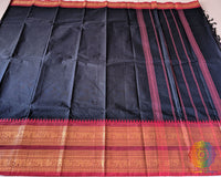Full black red Kanchi cotton saree laid open showcasing red border and overall design