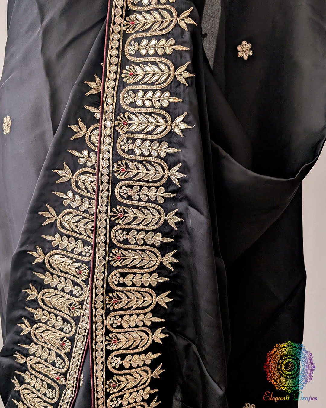 Close-up of Gota Patti Handwork on Black Satin Crepe Saree border