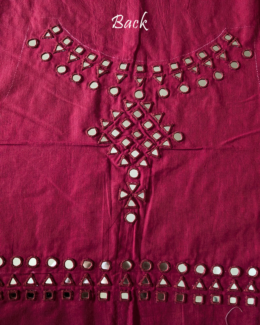 Back view of the Red Kala Cotton Kutch Mirror Handwork blouse piece, showcasing detailed traditional thread embroidery and real mirrors arranged in an intricate handcrafted design.