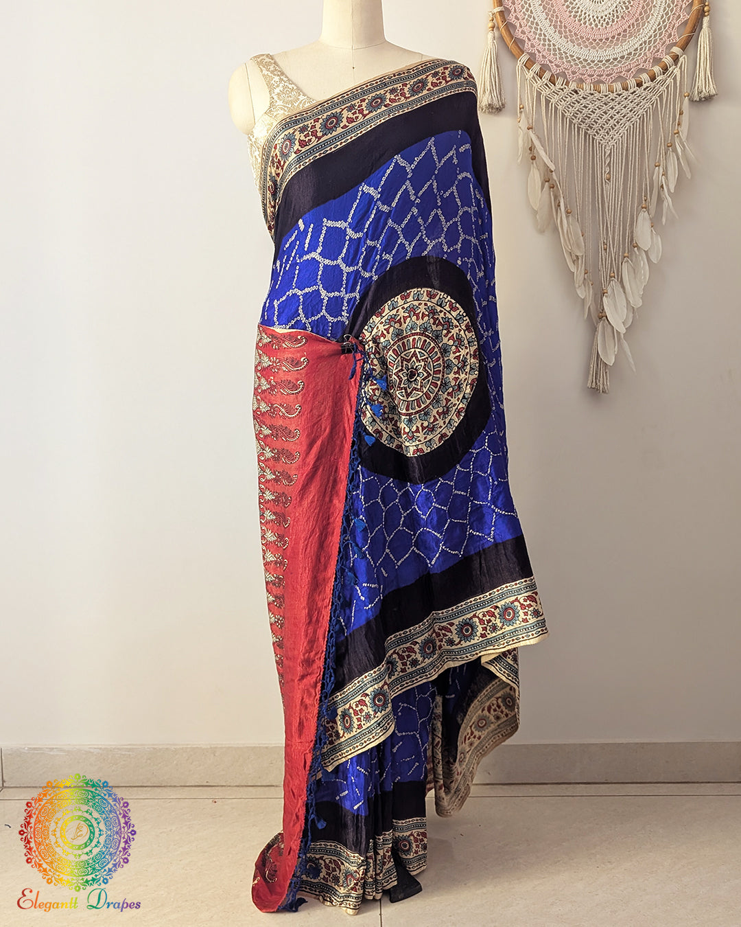 Royal blue gaji silk bandhani saree on mannequin showcasing Ajrakh border detail