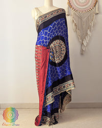 Royal blue gaji silk bandhani saree on mannequin showcasing Ajrakh border detail