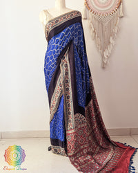 Royal blue bandhani gaji silk saree with Ajrakh palla on mannequin showing full drape