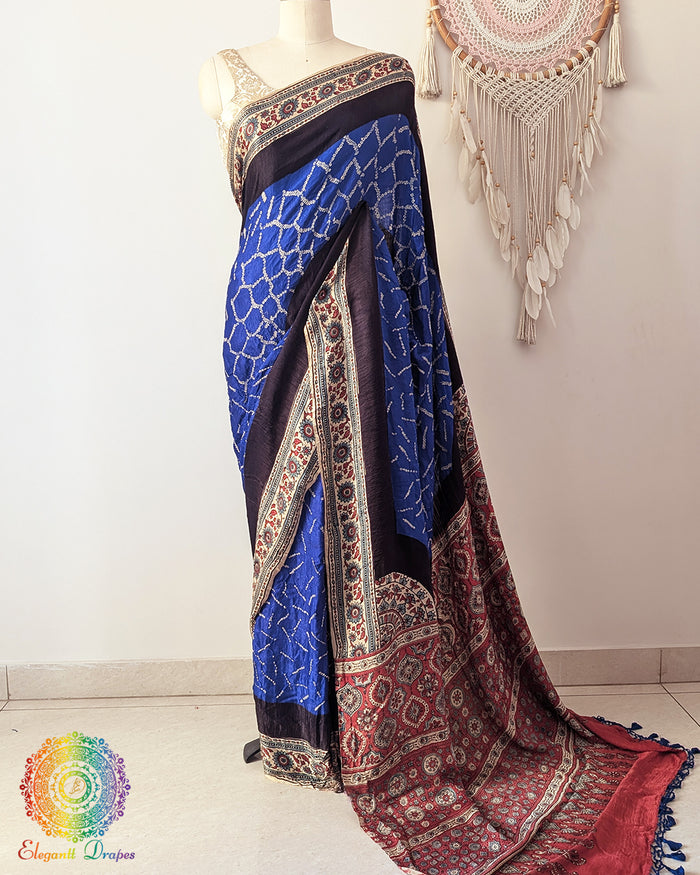 Royal blue bandhani gaji silk saree with Ajrakh palla on mannequin showing full drape