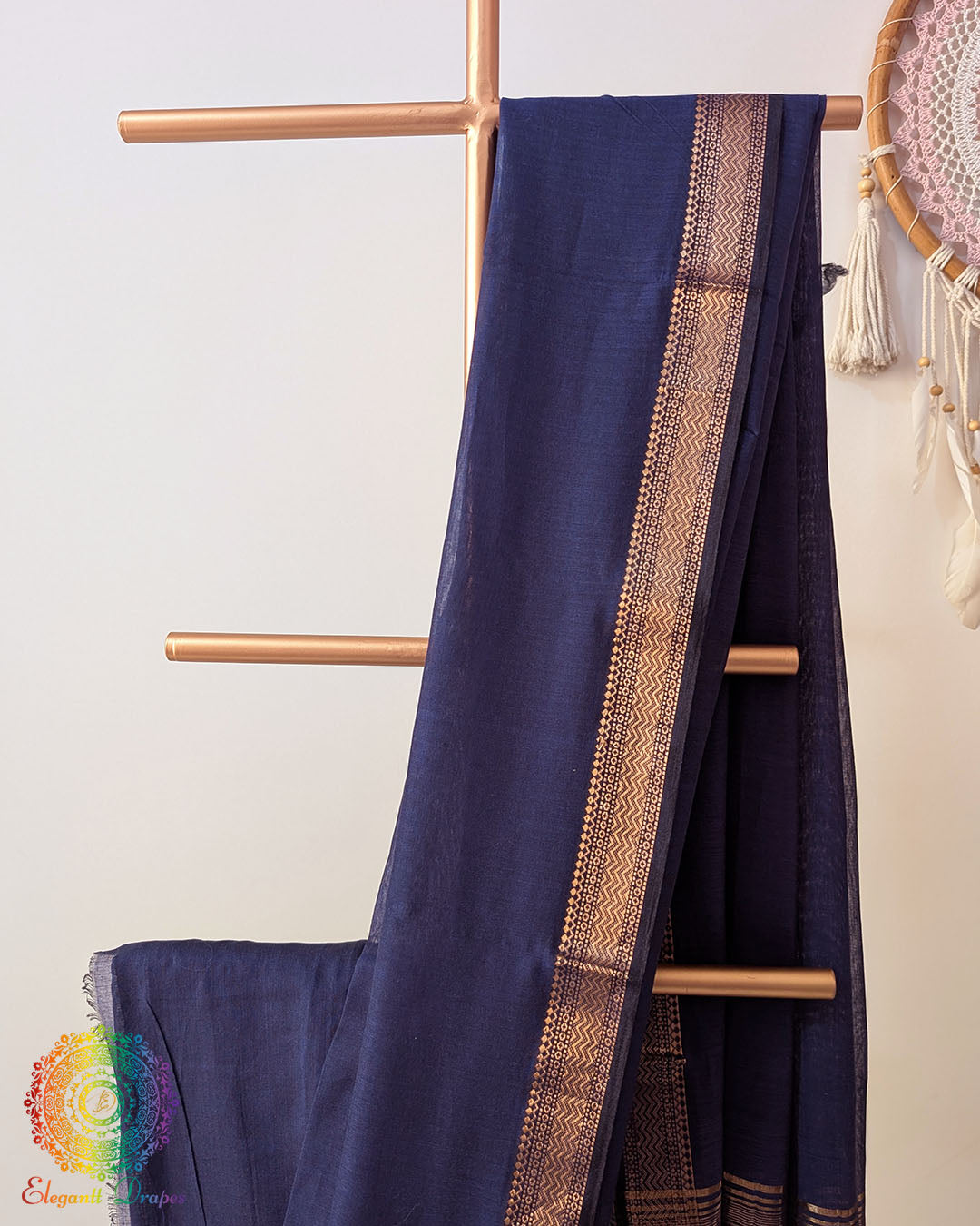 Navy blue Bengal cotton saree body close up highlighting fabric texture and border